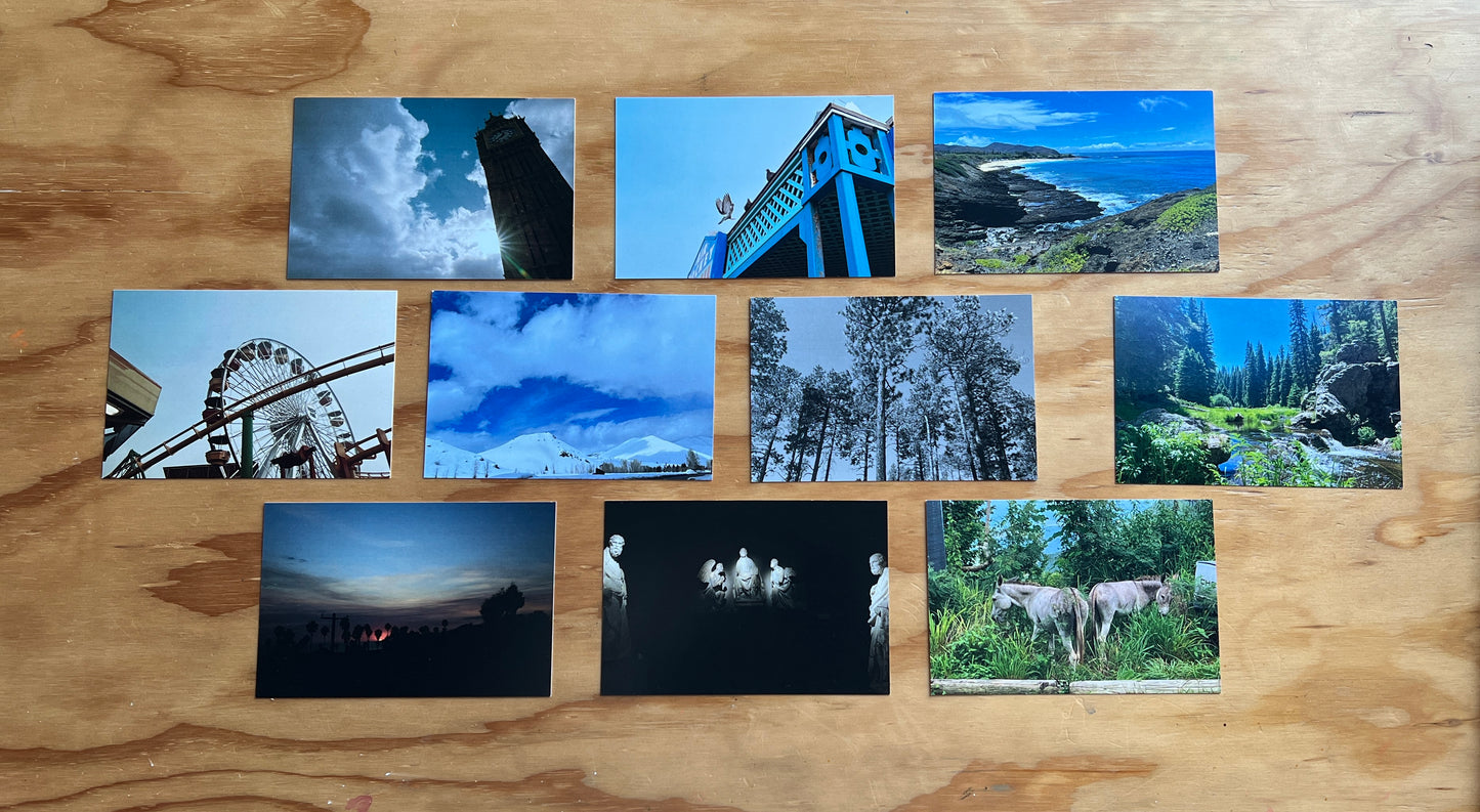 10 4x6 postcards of various images with 3 on the top and bottom row, 4 in the middle on a wooden background