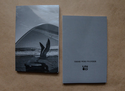 cover of notebook and back cover thats grey with 'those who wander' and unpunched logo