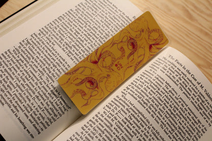 Open book with a decorative bookmark on a wooden surface