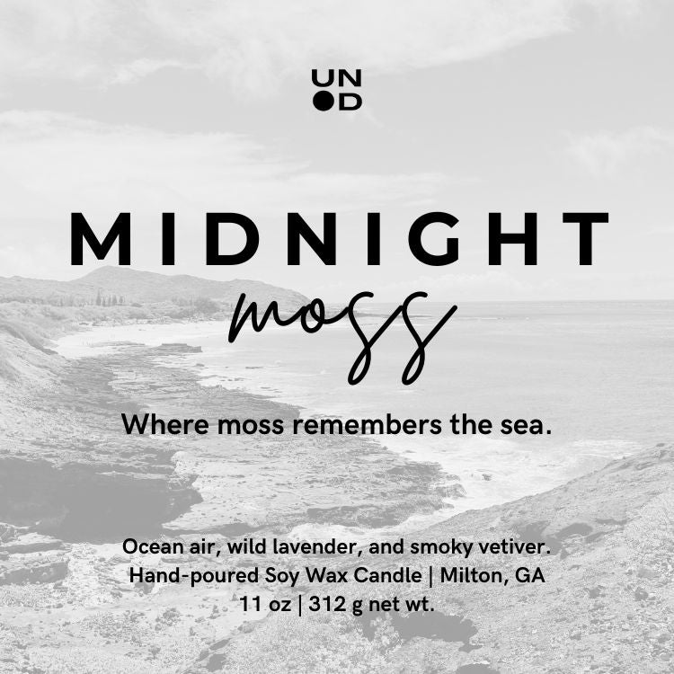 Candle label for 'Midnight Moss' with ocean-themed design and text.