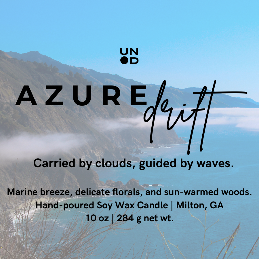 Candle packaging with 'Azure Drift' branding and a scenic background of mountains and ocean.
